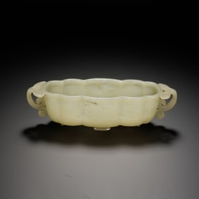 A CARVED WHITE JADE WASHER