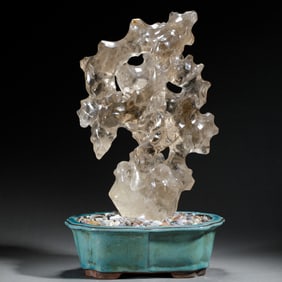 A CARVED ROCK CRYSTAL LITERATI ROCK