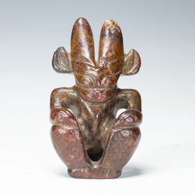 A CARVED JADE MYTHICAL FIGURE