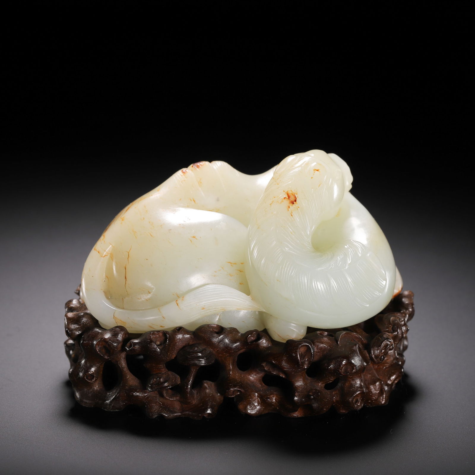 A CARVED WHITE JADE CAMEL