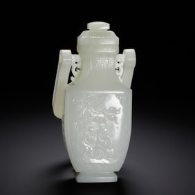 A FINE CARVED WHITE JADE FIGURAL STORY VASE WITH COVER