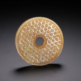 A JADE CARVING OF DISC BI