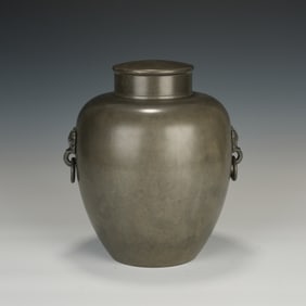 A TIN TEA CADDY WITH COVER