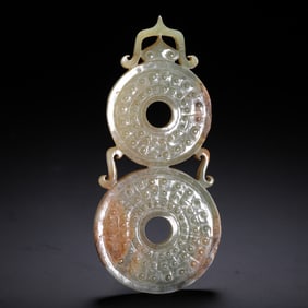 A CHINESE ARCHAISTIC JADE DISC BI