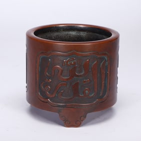 A BRONZE TRIPOD CENSER