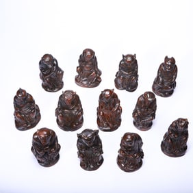 A SET OF TWELVE CARVED BAMBOO ZODIAC ANIMALS