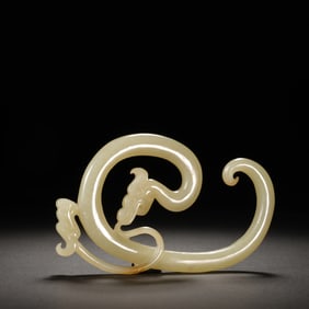 A CARVED WHITE JADE DRAGON LOONG