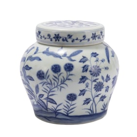 A BLUE AND WHITE JAR WITH COVER