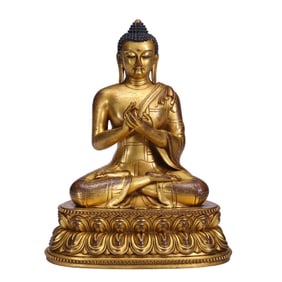 A BRONZE-GILT FIGURE OF SHAKYAMUNI