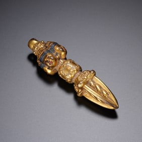 A TIBETAN BRONZE-GILT PHURBA