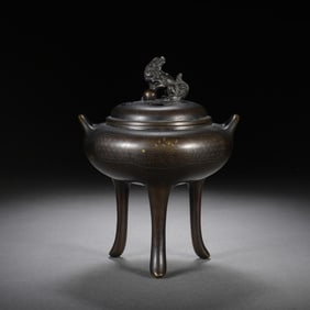 A BRONZE TRIPOD CENSER WITH COVER
