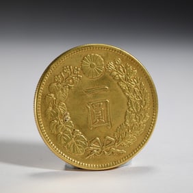 A CHINESE SILVER-GILT COIN
