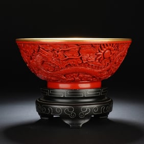 A CARVED CINNABAR LACQUER DRAGON BOWL