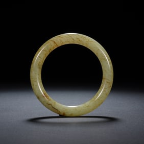 A YELLOW JADE BANGLE