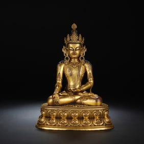 A BRONZE-GILT FIGURE OF MEDICINE BUDDHA