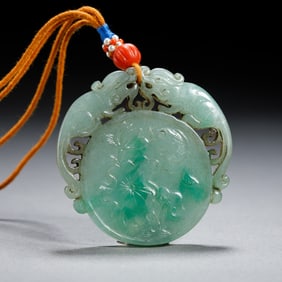 A CARVED SPINACH GREEN JADE PLAQUE