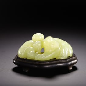 A CARVED YELLOW JADE BOYS GROUP
