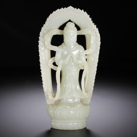 A CARVED WHITE JADE STANDING GUANYIN