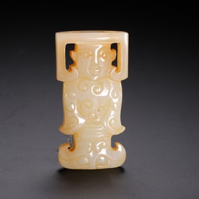 A JADE CARVING OF STANDING FIGURE