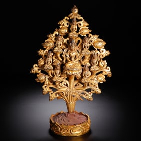 A BRONZE-GILT AMITAYUS WITH ATTENDANTS