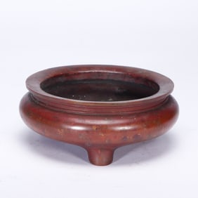 A BRONZE TRIPOD CENSER