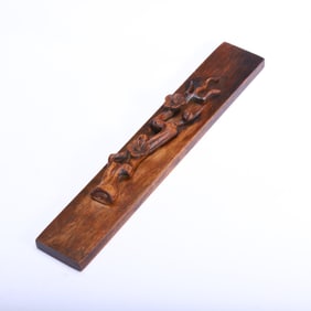 A CARVED HUANGHUALI PLUM BLOOMS PAPER WEIGHT