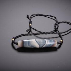 A TIBETAN DZI BEAD NECKLACE