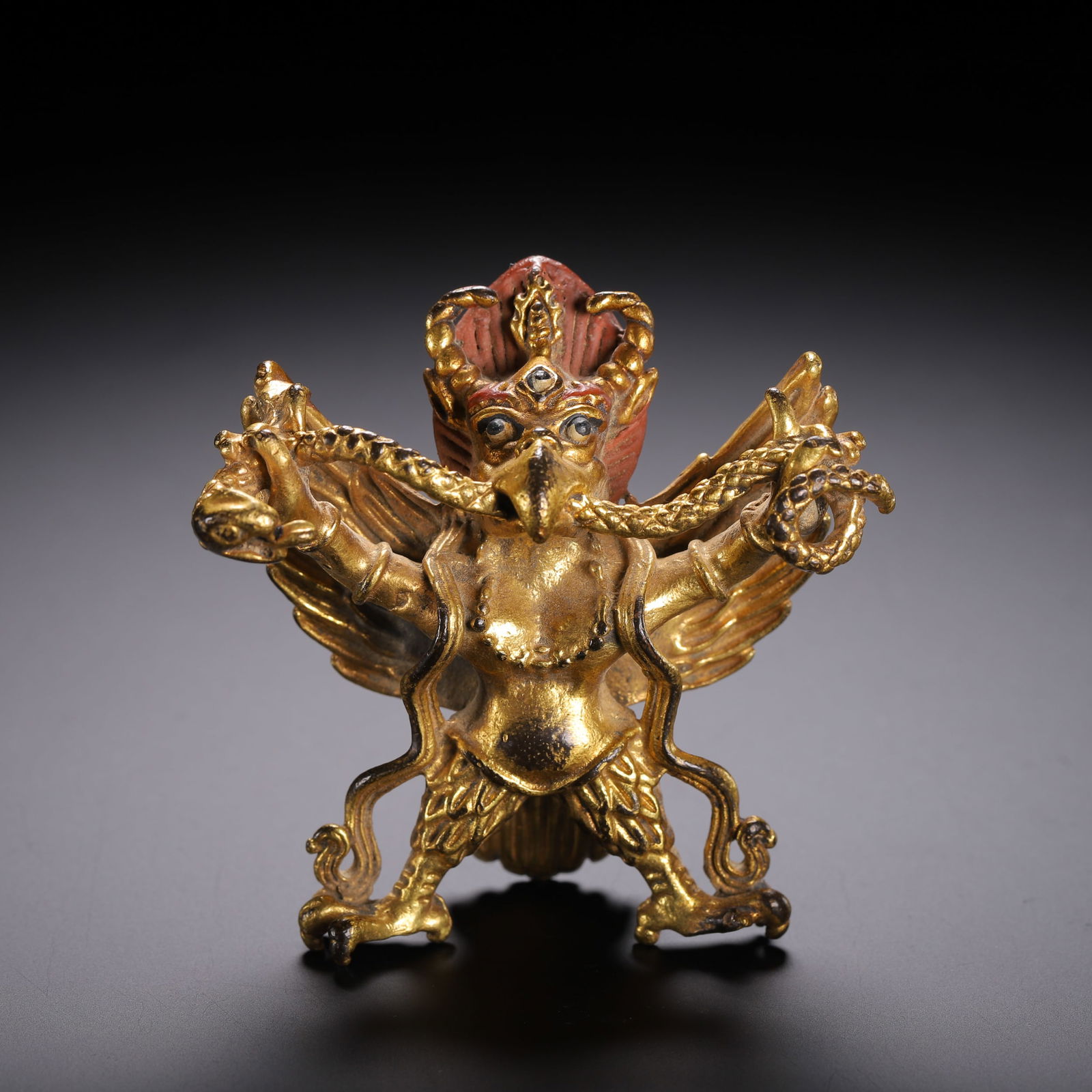 A BRONZE-GILT STANDING GARUDA (1 of 9)