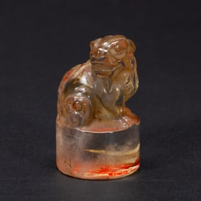 A CARVED ROCK CRYSTAL FELINE SEAL