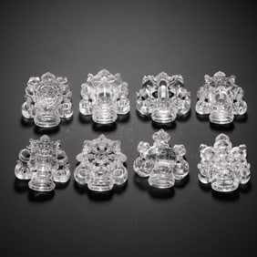 A COLLECTION OF EIGHT CARVED ROCK CRYSTAL BUDDHIST SYMBOLS ORNAMENT