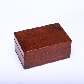 A CARVED WOODEN BOX WITH COVER