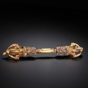 A TIBETAN BRONZE-GILT VAJRA