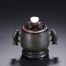 A BRONZE CENSER WITH HANDLES