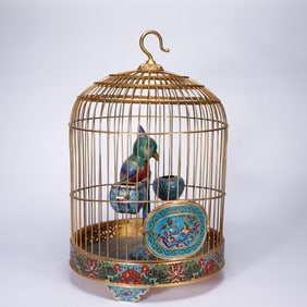 A CLOISONNE ENAMEL PARROT WITH CAGE