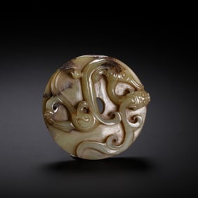 A CARVED CELADON JADE CHILONG DISC BI