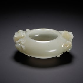 A CARVED WHITE JADE CHILONG WASHER