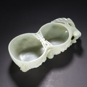 A CARVED WHITE JADE DOUBLE GOURDS FORM WASHER