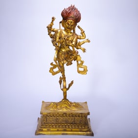 A RARE BRONZE-GILT STANDING PROTECTOR