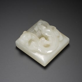 A CARVED WHITE JADE CHILONG SEAL