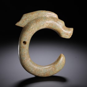 A CARVED JADE C-FORM DRAGON