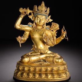 A BRONZE-GILT FIGURE OF MANJUSRI