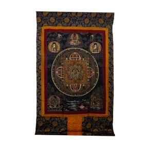 AN EMBROIDERED THANGKA DEPICTING GREEN TARA