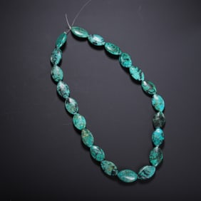 A TURQUOISE BEADED NECKLACE