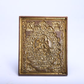 A TIBETAN BRONZE-GILT PADMASAMBHAVA PLAQUE