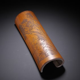 A CARVED BAMBOO WRIST-REST