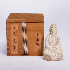 A TING-WARE SEATED GUANYIN
