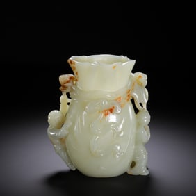 A CARVED WHITE JADE VESSEL WITH BOYS