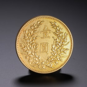 A CHINESE SILVER-GILT COIN