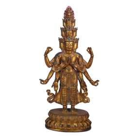 A SINO-TIBETAN BRONZE-GILT STANDING AVALOKITESVARA