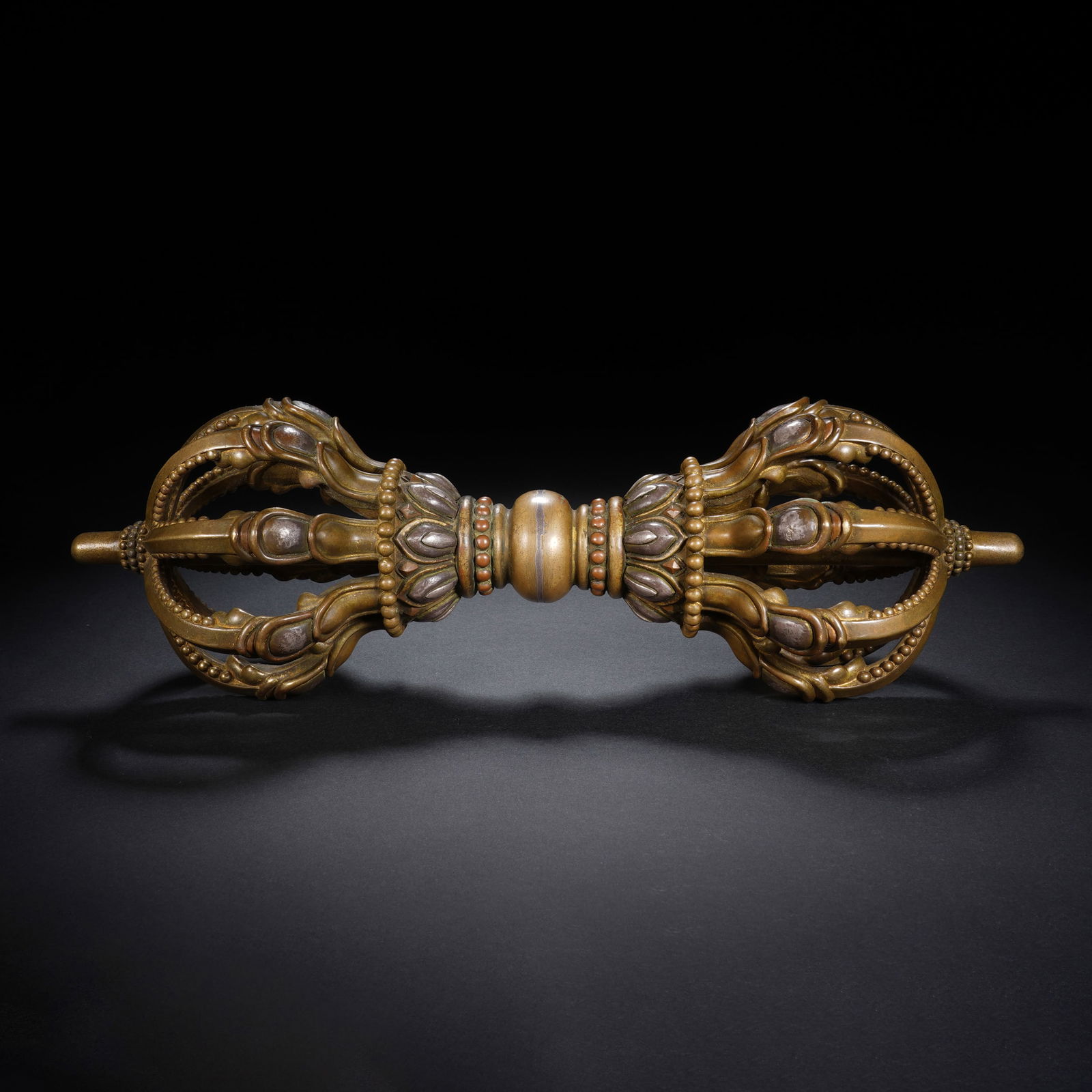 A SILVER INLAID BRONZE VAJRA (1 of 7)